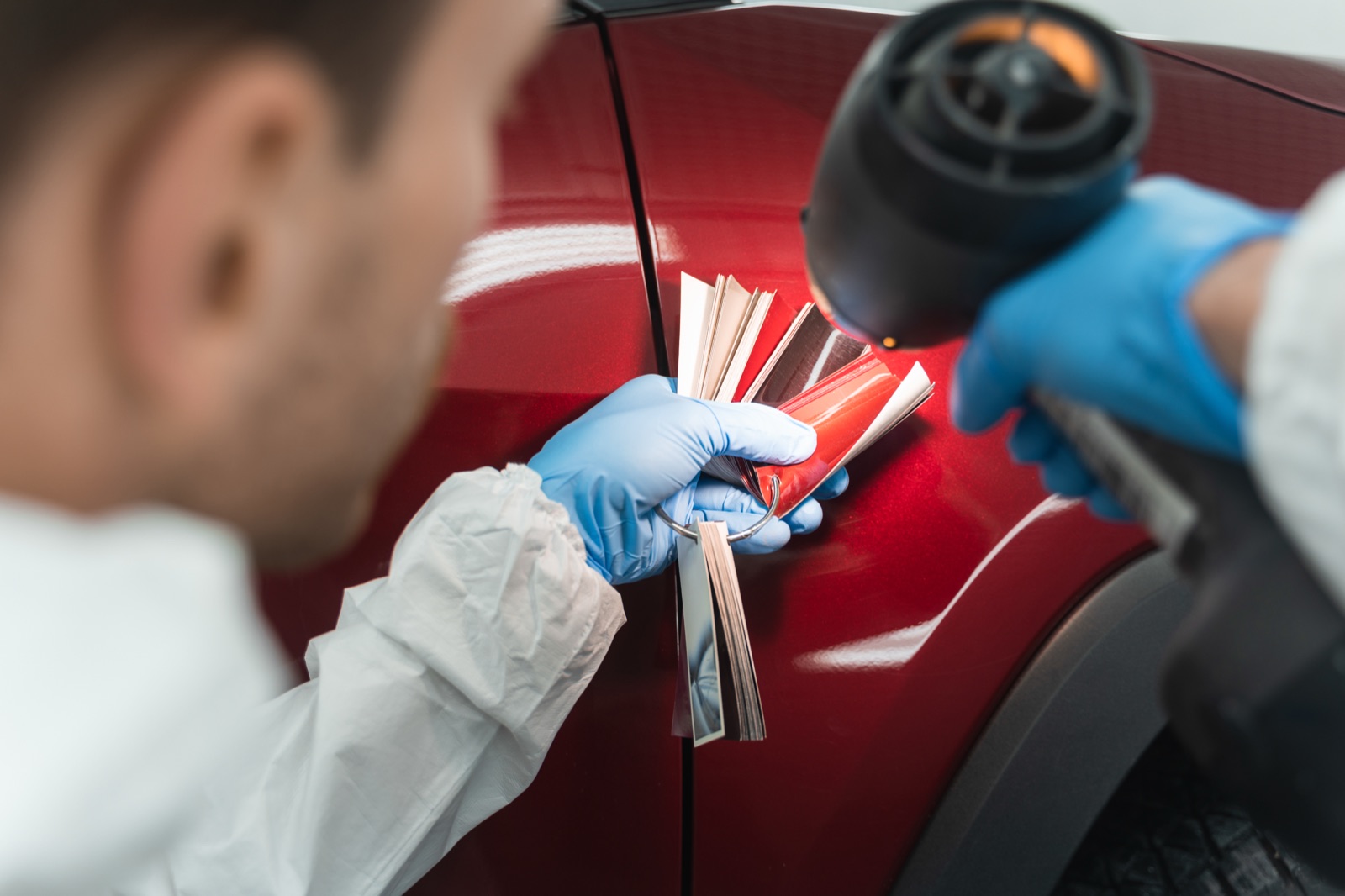 Specialist verifying paint code and finish